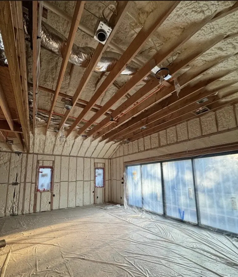 Interior walls and ceiling insulated with spray foam during new construction in Ironton